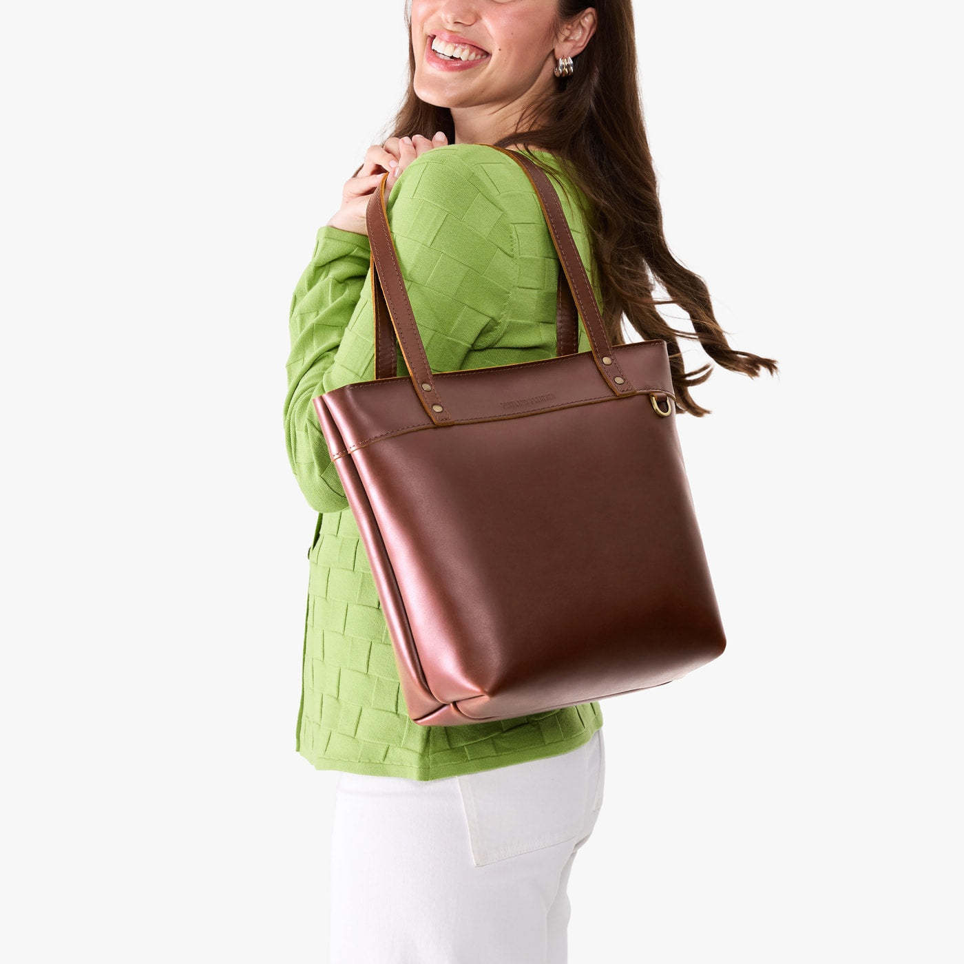 Cognac*Medium*Zipper | Model wearing leather tote bag with riveted straps and exterior key loop