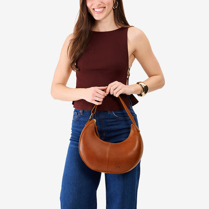 Honey*Small | Crescent shaped shoulder bag with zipper closure and adjustable strap