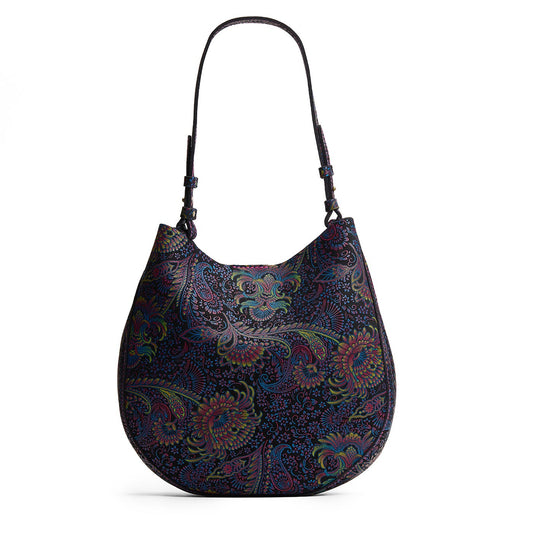 Carnival*Large | Model holding round leather purse with adjustable shoulder strap
