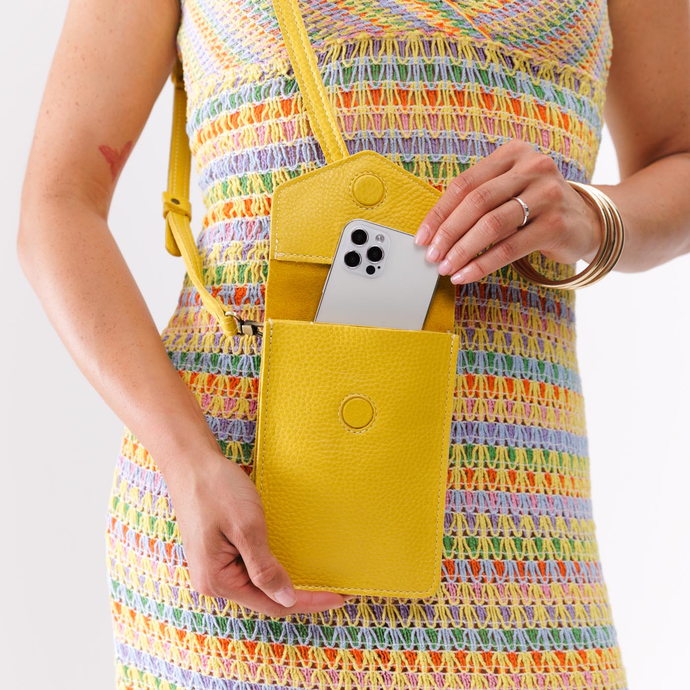 Naples | Model wearing slim, phone-shaped crossbody purse with magnetic closure