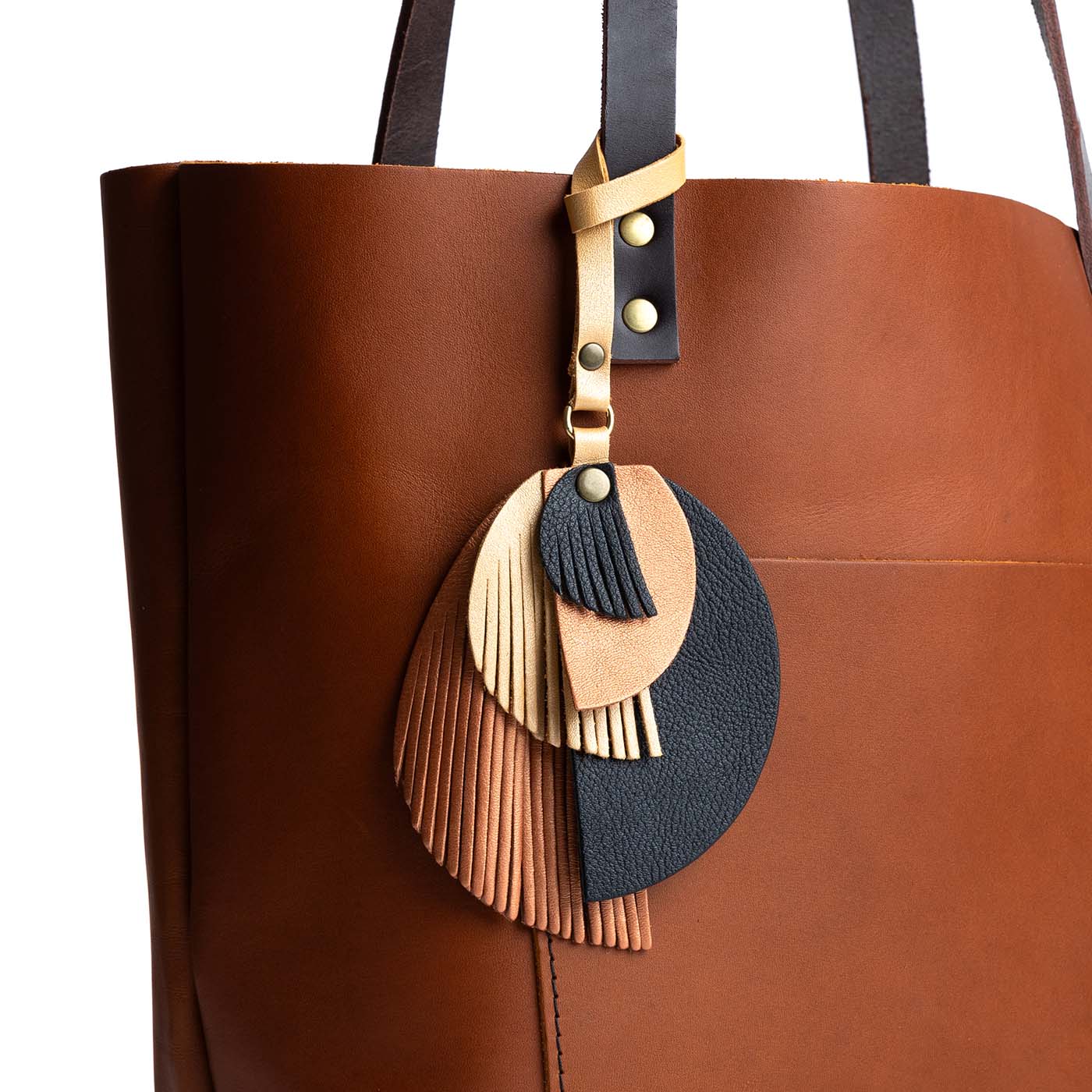 Cleopatra | Intricately cut leather shapes and fringe