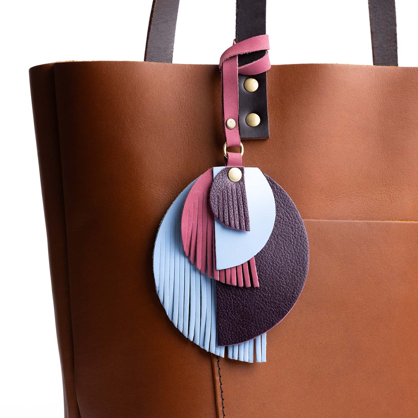 Meteor | Intricately cut leather shapes and fringe