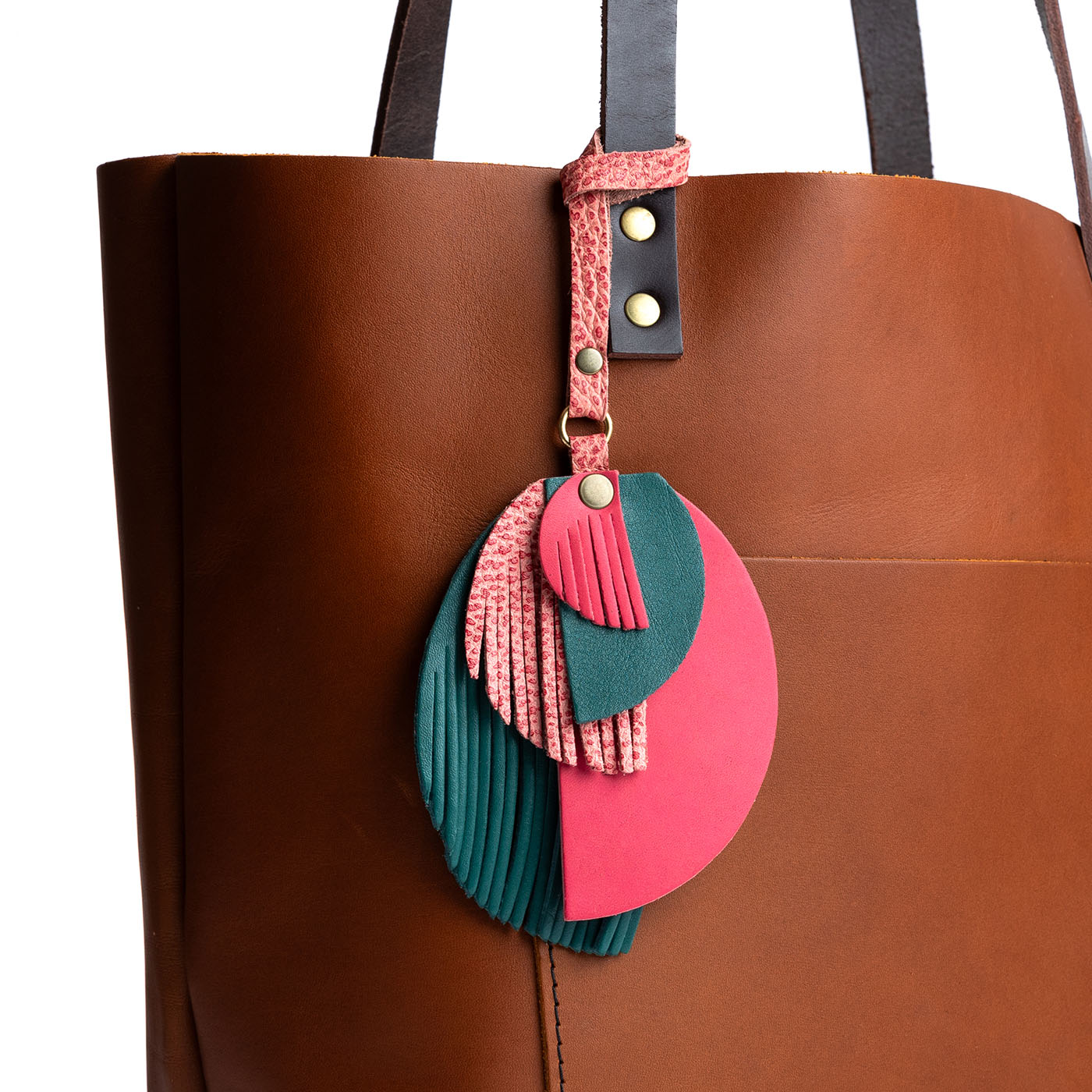 Quetzal | Intricately cut leather shapes and fringe