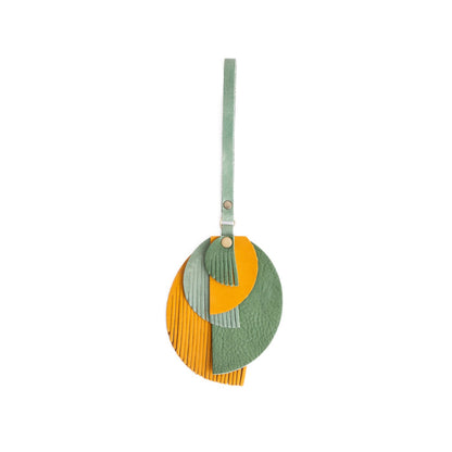 Toucan | Intricately cut leather shapes and fringe