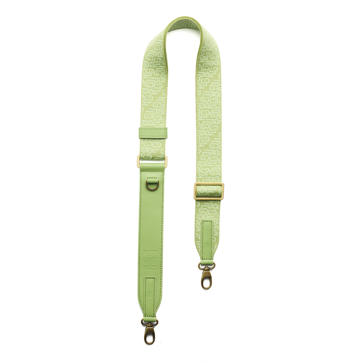 Citrus Rush | Leather and webbing strap with repeating PLG lettering on a white background