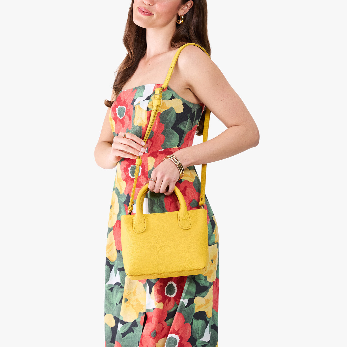 Canary*Small | Model wearing a petite tote purse with structured leather handles and crossbody strap