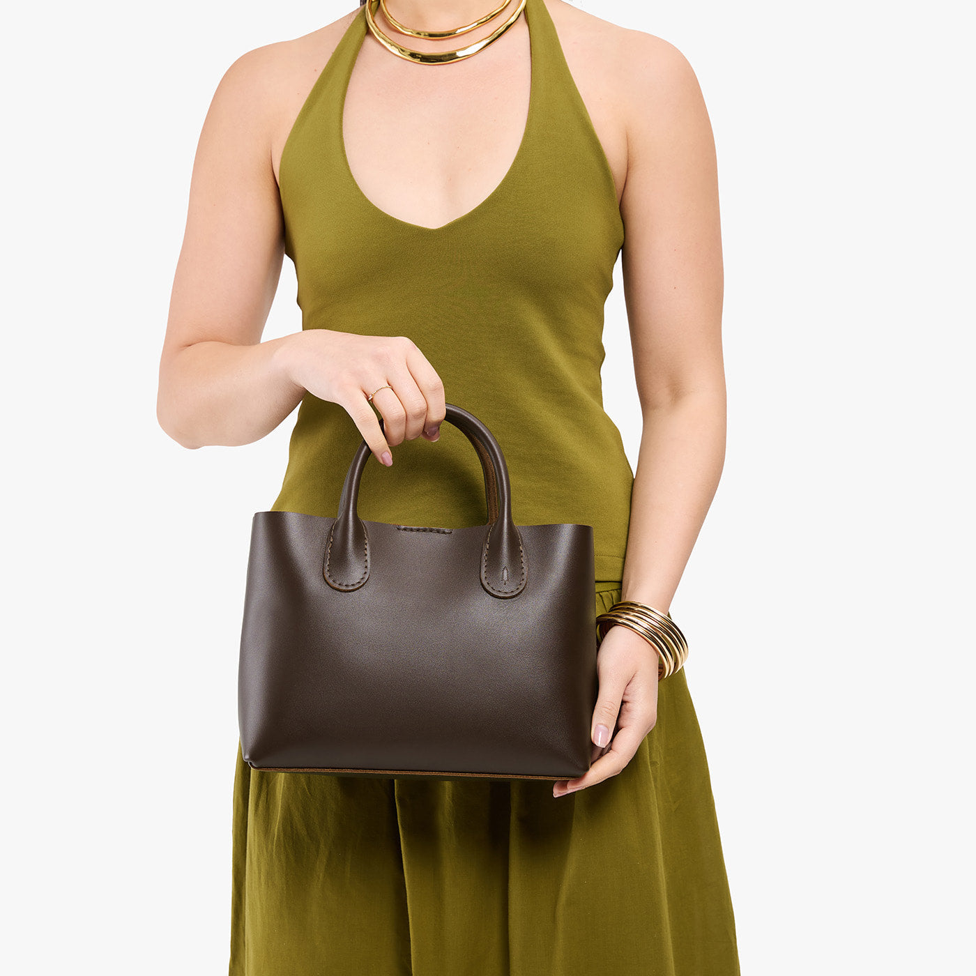 Grizzly*Large | Model holding mid-size tote purse with structured leather handles and crossbody strap