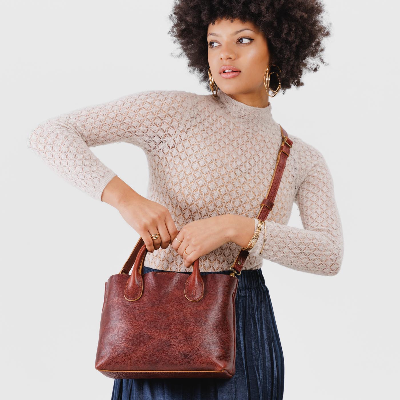 Cinnamon Bear*Large | Model holding mid-size tote purse with structured leather handles and crossbody strap