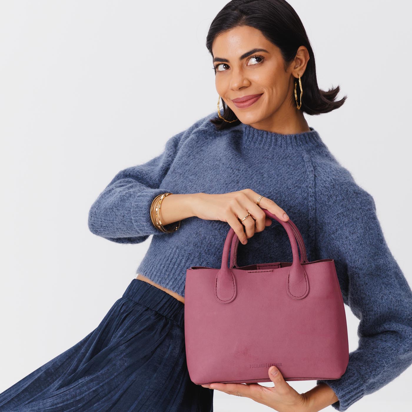 Foxglove*Large | Model holding mid-size tote purse with structured leather handles and crossbody strap