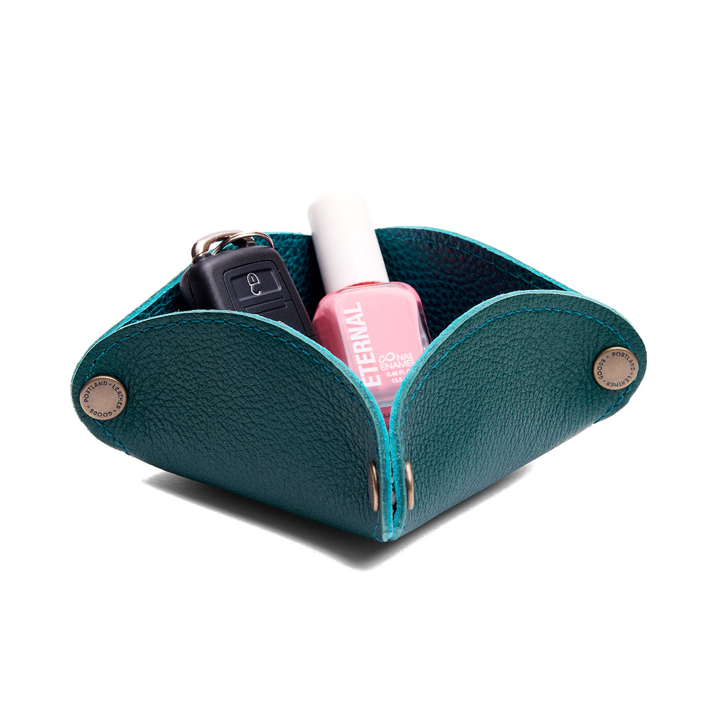 Sea Glass | Square-shaped foldable leather tray with snap-button corners holding car keys and nail polish