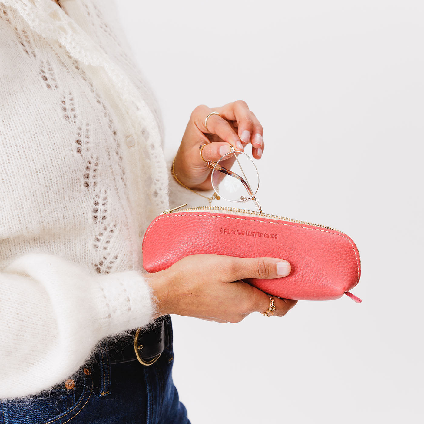 All Color: Sugar | Leather pouch with curved seams and top zipper