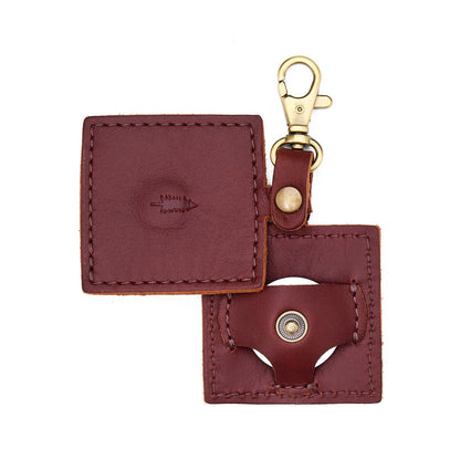 Cognac | Square-shaped leather AirTag holder with snap closure and swivel lobster claw clasp