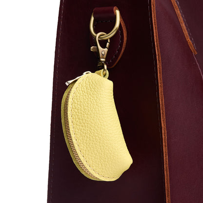 Butter Bliss | Taco shaped leather pouch with zipper and swivel lobster clasp on bag