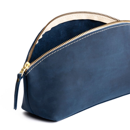 Deep Water | Spacious leather makeup bag with curved seams and top zipper open