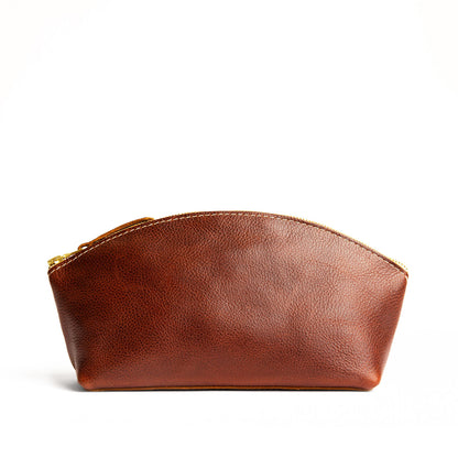 Nutmeg*Total Eclipse | Spacious leather makeup bag with curved seams and top zipper