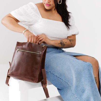 All Color: Cognac*Classic | Model holding square slim leather tote backpack