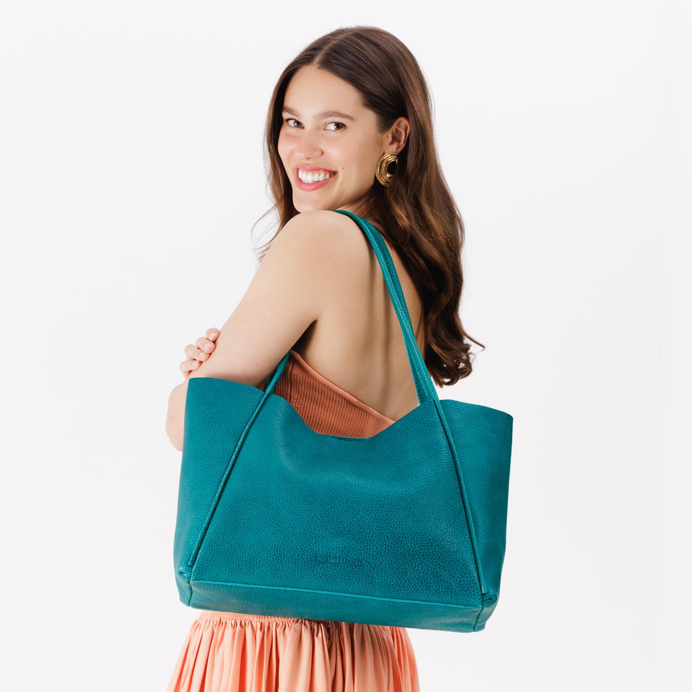 Aquarius*Large | Model holding large rectangular tote bag