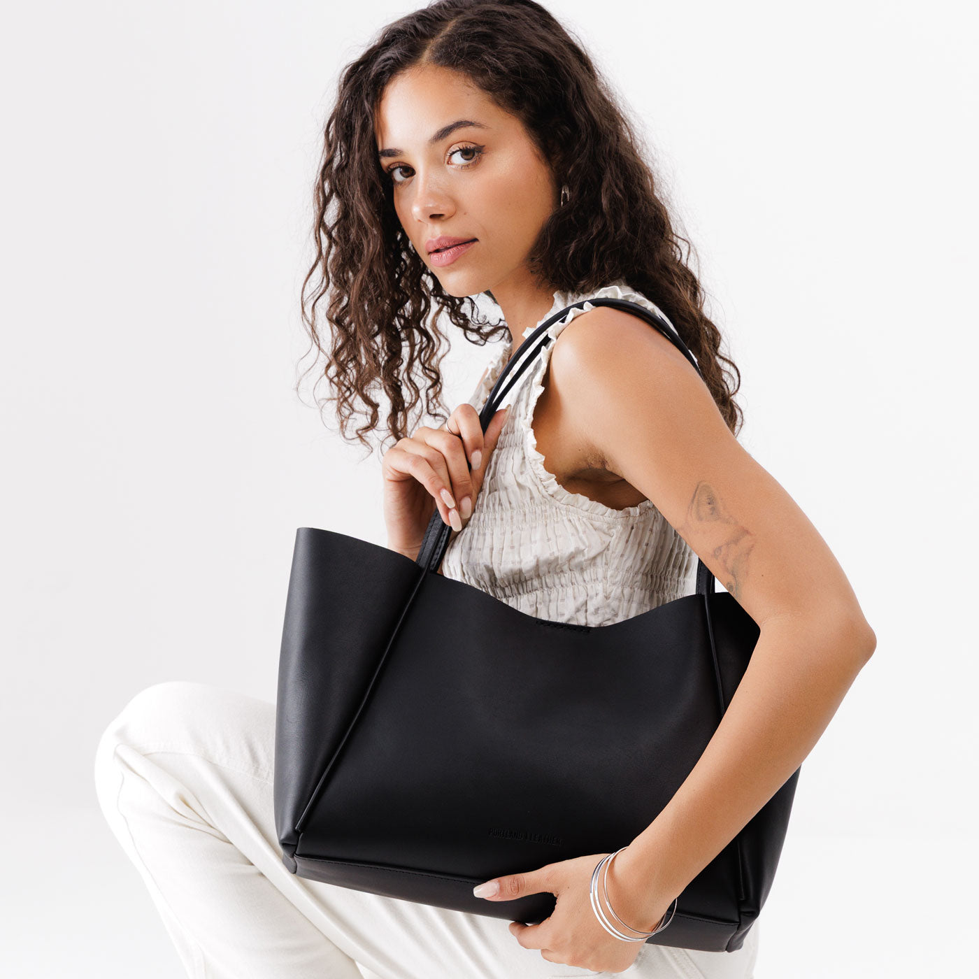 Black*Large | Model holding large rectangular tote bag