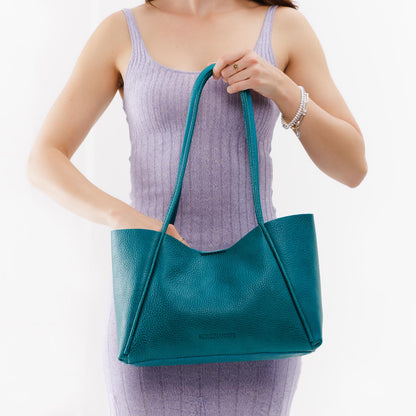 Aquarius*Medium | Model holding midsize rectangular tote bag