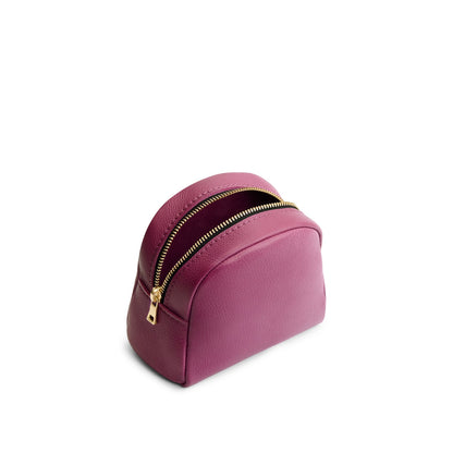 Iris | Curved top leather pouch with zipper opening, flat base, and three metal tree emblems in front